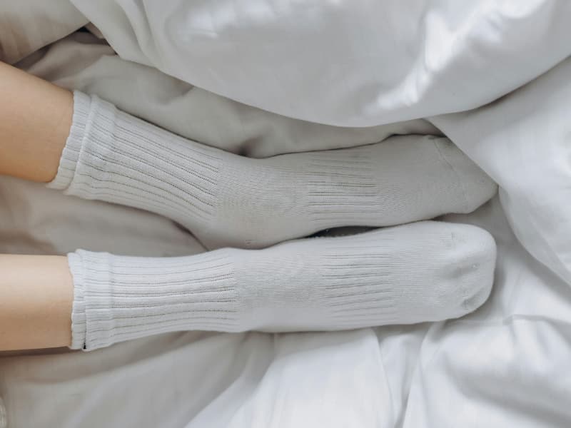 Illustration of clean cotton socks as part of a simple natural nail appearance ritual
